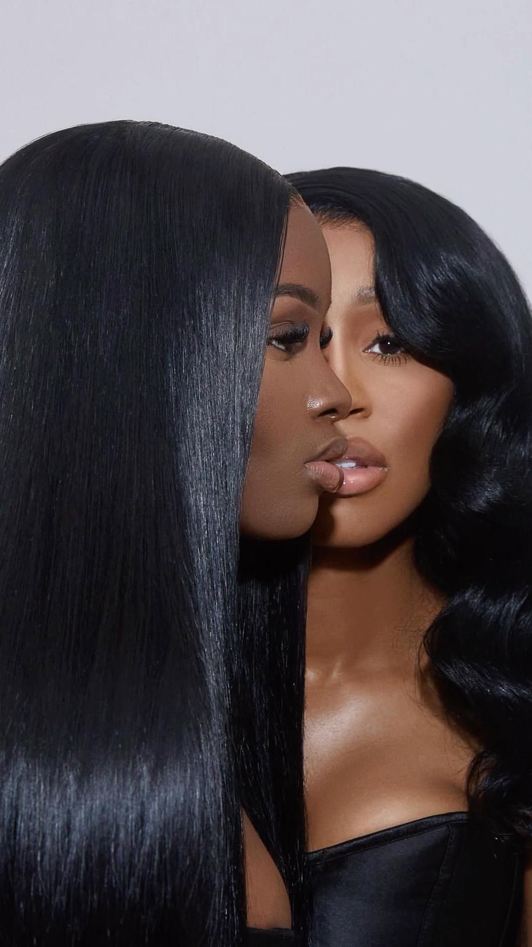 Stunning Black woman styled in a voluminous body wave lace front wig